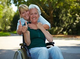 rsz_nurse_with_lady_in_wheelchair.jpg